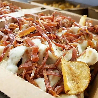 Patate con Fonduta di Formaggi Misti e Julienne di Bacon